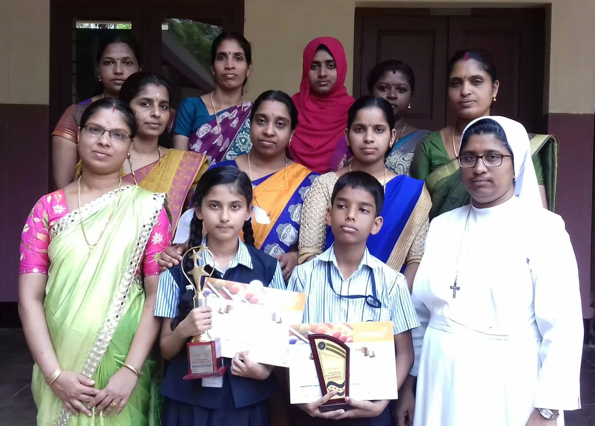 Excel Abacus students with teachers and awards